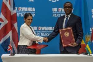 The UK home secretary at the time Priti Patel signed the deal with Rwandas Foreign Minister Vincent Biruta in April 2022.  By Simon WOHLFAHRT (AFP)