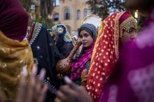 The women attract attention with their colourful embroidered tunics and veils, their foreheads adorned with jewellery.  By Michele Spatari (AFP)