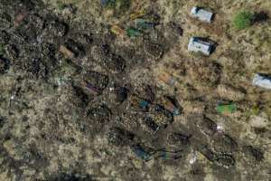 This aerial view taken on November 21 shows a cemetery where alleged victims of the November 9 massacre were buried in collective graves in Mai-Kadra.  By EDUARDO SOTERAS (AFP)