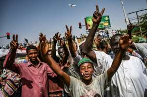 Thousands of demonstrators are still camped out by Sudan's army headquarters a week after Bashir was toppled. By OZAN KOSE (AFP)
