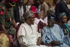 Tinubu (right) was seen as instrumental in the 2015 election of President Muhammadu Buhari (left).  By STEFAN HEUNIS (AFP)