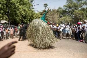 Tourists and locals alike flock to Janjanbureh for the festival, in a boost for the local economy.  By MUHAMADOU BITTAYE (AFP)