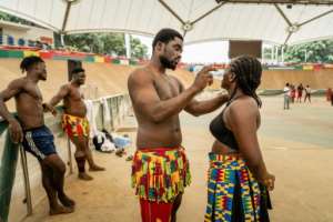 Traditional West African wrestling -- and the gargantuan, sometimes sumo-like men who step into the ring -- captivates audiences across the region, from stadiums in Senegal to desert villages in Niger.  By Light Oriye Tamunotonye (AFP)