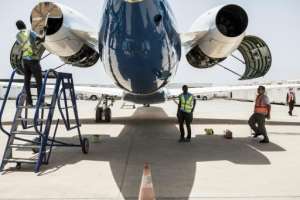 Transairs ground crew prepare a twin-jet Embraer for a one-hour technical flight, one of the few exceptions allowed under Senegals anti-coronavirus restrictions.  By JOHN WESSELS (AFP)