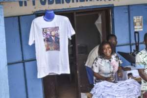 T-shirts with a portrait of former Liberian president Samuel Doe were on sale as the country held a funeral for him, 35 years after he was tortured and killed.  By Matthew Jacobs (AFP)