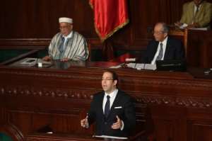 Tunisian Prime Minister Youssef Chahed addresses parliament in Tunis ahead of a vote of confidence in his reshuffled government on September 11, 2017