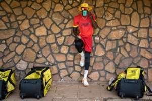 Ugandas strip is a vivid red with splashes of yellow.  By Badru Katumba (AFP)