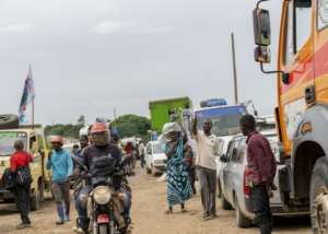 Unlike well-kept Rwandan roads, the eastern DR Congo roads are crumbling.  By Glody MURHABAZI (AFP)