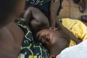 UN-run health centres teach mothers how to make porridge with local produce.  By Arsene Mpiana (AFP)