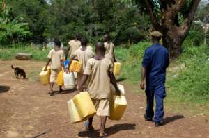Water is so scarce at Bo prison that inmates are sent out under escort to fill jerricans from streams or wells -- the trek can be several kilometres.  By Saidu BAH (AFP)