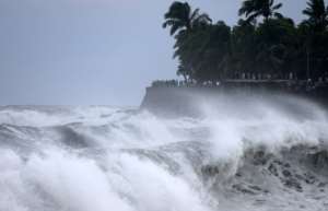 Waves were reported to tower eight metres (26 feet).  By Richard BOUHET (AFP)