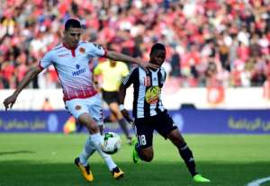 While the primary task of Wydad Casablanca left-back Mohammed Nahiri (L) is to defend, he has scored five goals in the CAF Champions League this season. By STRINGER (AFP/File)