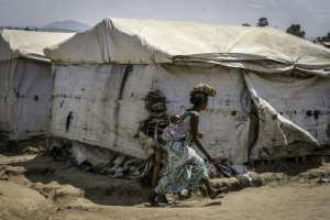 With nearly one million people crowded into camps across Ituri province in eastern DRC, aid groups warn of a looming humanitarian disaster if Ebola spreads further.  By Glody MURHABAZI (AFP)