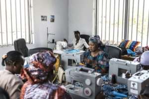 Women who lost family members at sea take part in a sewing class at the DDM offices in Mbour.  By PATRICK MEINHARDT (AFP)