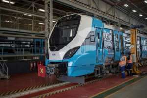 Workers inspect a new train.  By Michele Spatari (AFP)