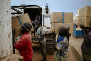 Workers loaded food onto World Food Programme vehicles in Bentiu, South Sudan, in November 2025. By Rian COPE (AFP/File)