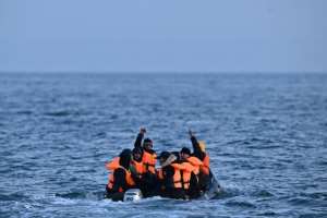 Would-be asylum seekers cross the Channel in an inflatable dinghy. By Ben Stansall (AFP)