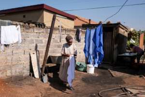 Xolani's great-grandmother Flora Vuvama, 83, (pictured) looks after the family with just $170 (around 150 euros) of welfare cash a month. By WIKUS DE WET (AFP)