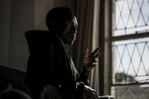 Zimbabwean national Benson Jere took refuge in a protected shelter.  By MARCO LONGARI (AFP)
