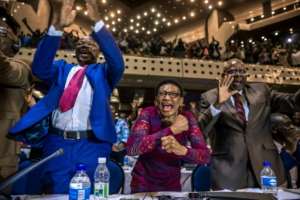 Zimbabwes members of parliament celebrate after Mugabes resignation