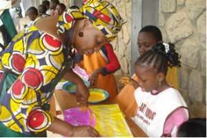 Dr. Layiwola with children at a workshop at the Institute of African Studies, Lagos.