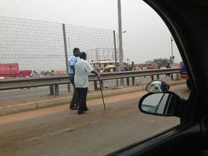 Poor old man struggles to cross the George Bush Highway
