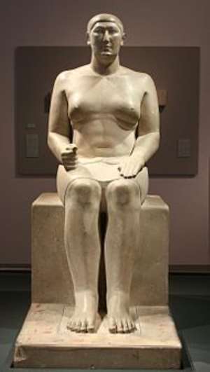 Statue of Hemiunu at the Pelizaeus Museum , Hildesheim , Germany , his feet rest on columns of hieroglyphs painted in yellow, red, brown, Wikipedia.
