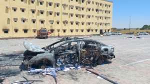 A burnt vehicle outside the House of Representatives in the eastern city of Tobruk, seen on July 2, 2022, after angry protesters stormed the building, ransacking its offices and torching part of it. By - AFPFile