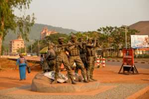 A monument near the University of Bangui pays tribute to Russian private security operators and fighters who 'died for the liberation' of the CAR. It depicts four armed men protecting a mother and her children. By AFP