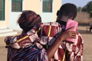 A mother in N'Djamena hugs her son on December 8 after he was released on bail. By Denis Sassou Gueipeur AFP