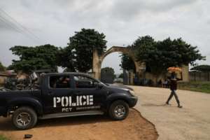 A police truck stands outside the University of Abuja staff Quarters gate where gunmen kidnapped university professors, lecturers and family members on November 2, 2021. By Kola Sulaimon AFPFile