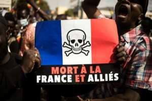 A sign reading 'Death to France and its allies' at a rally in Bamako in January, sparked by regional sanctions against the junta-led country. By FLORENT VERGNES AFP