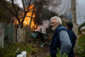 A structure on fire after shelling in the town of Bakhmut, in eastern Ukraine's Donbas region, on October 23, 2022, amid Russia's military invasion of Ukraine. By Dimitar DILKOFF AFP