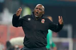 Al Ahly coach Pitso Mosimane reacts during a Club World Cup match against Duhail from host nation Qatar in Al-Rayyan.  By KARIM JAAFAR AFPFile