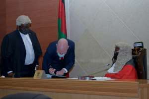 Albino activist Overstone Kondowe is sworn into Malawi's parliament. By AMOS GUMULIRA AFP