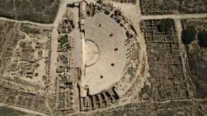 An aerial view of the theatre which seated up to 15,000 spectators on arched terraces overlooking the Mediterranean Sea. By Mahmud TURKIA AFP