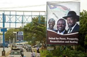 April 2016: Machar, centre, and Kiir, right, send a message of unity. By ALBERT GONZALEZ FARRAN cdsAFPFile