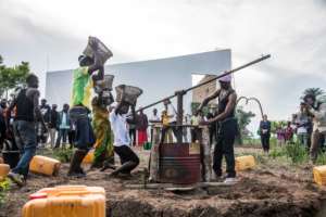 Artists perform at the inauguration of a art gallery in Lusanga, funded by local artworks reproduced as chocolate sculptures