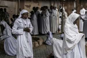 At church services across the country, congregants prayed for peace. By MARCO LONGARI AFP