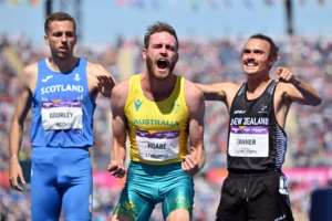 Australia's Oliver Hoare centre reacts after winning the men's 1500m at the 2022 Commonwealth Games. By Glyn KIRK AFP