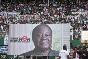Bedie, seen here in a poster at an opposition rally, has called for civil disobedience against Ouattara's third term. By SIA KAMBOU AFPFile