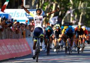 Biniam Girmay celebrates making history. By Luca Bettini AFP
