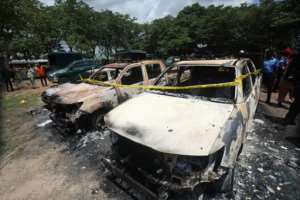 Burnt vehicles outside Kuje prison. By Kola Sulaimon AFP