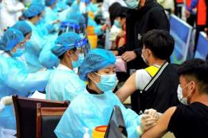 China has already approved four homegrown vaccines. By STR, STR AFP