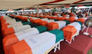 Conflict: A mass burial of 100 victims of the fighting, in October 2011. By SIA KAMBOU AFP