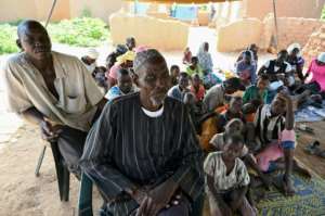 Displaced: 74-year-old farmer Belem Boureima and his family. By ISSOUF SANOGO AFP