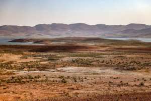 Dry landscape circles Al Massira Dam, Morocco's second largest. By FADEL SENNA AFP