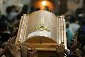 Egyptian mourners carry the coffin of a child killed in the Cairo Coptic church fire at the Church of the Blessed Virgin Mary in Giza Governorate on August 14, 2022. By Khaled DESOUKI AFPFile