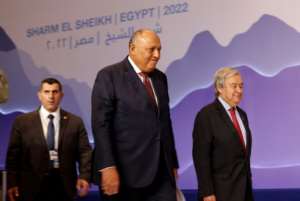 Egypt's Foreign Minister and COP27 chair Sameh Shoukry, in the centre, with United Nations Secretary-General Antonio Guterres on the right. By Mohammed ABED AFPFile