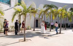 Facemasks and social distancing will forever be on this couple's wedding photographs to mark their Beverly Hills ceremony. By VALERIE MACON AFP